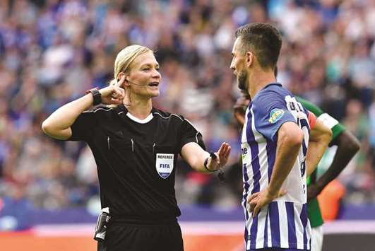 Referee Bibiana Steinhaus talks with Hertha Berlinu2019s Bosnian forward Vedad Ibisevic during the Bundesliga match between Hertha Berlin and Werder Bremen in Berlin yesterday. (AFP)