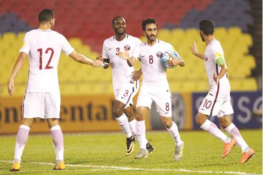 Qataru2019s Ali Asadallah (second right) celebrates with teammates after scoring against Syria in the 2018 World Cup qualifier in Melaka, Malaysia, yesterday. Qatar lost 1-3. The result ended Qataru2019s fleeting hopes of qualifying for Russia 2018.