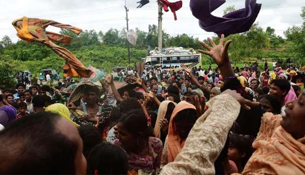 Newly arrived Rohingya refugees scuffle for relief supplies at Kutupalong refugee camp