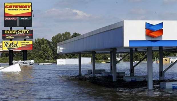 A gas station submerged under flood waters from Tropical Storm Harvey is seen in Rose City, Texas.