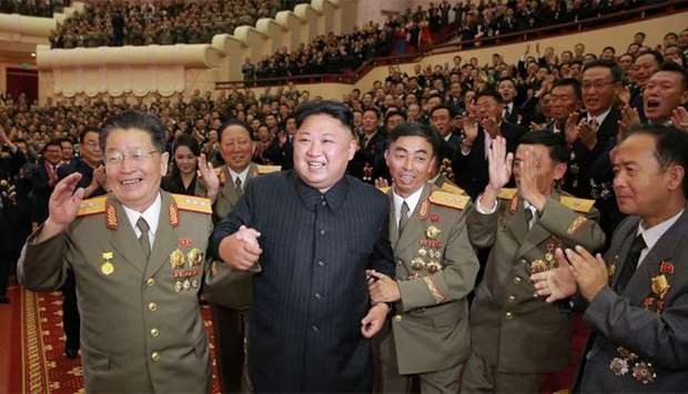 North Korean leader Kim Jong-Un (front 2nd L) attending an art performance dedicated to nuclear scientists and technicians