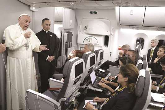 Pope Francis speaking with journalists during a news conference held on board the flight to Rome, at the end of his five-day visit to Colombia.
