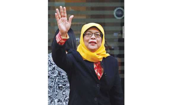Former speaker of Singaporeu2019s parliament, Halimah Yacob arrives at the Elections Department after she was given the certificate of eligibility to contest the election by the Presidential Elections Committee in Singapore.