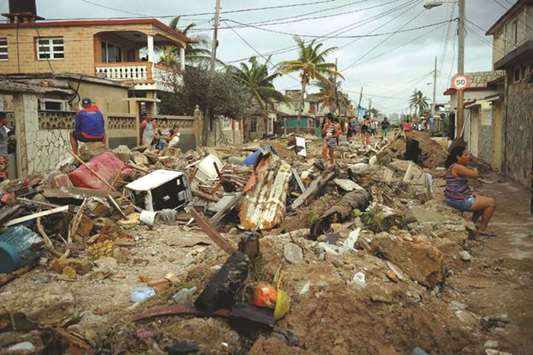 Hurricane Irma tore off roofs, felled trees and downed electricity poles, causing flooding in many coastal towns, including the capital Havana, and leaving millions without electricity