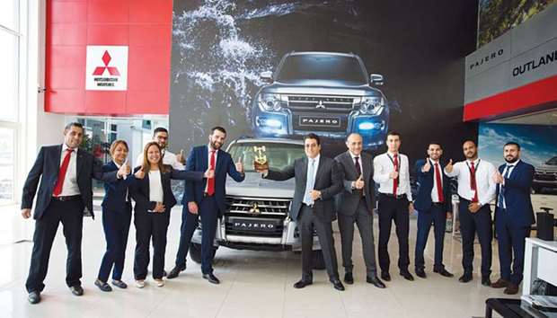 Qatar Automobiles Company officials and staff with the award.