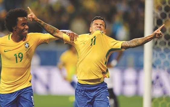 Philippe Coutinho (right) of Brazil celebrates his goal against Ecuador with teammate Willian. (Reuters)