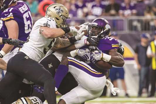 Minnesota Vikings running back Dalvin Cook (No 33) is tackled by New Orleans Saints linebacker AJ Klein during the first quarter of the NFL game at US Bank Stadium.  PICTURE: USA TODAY Sports