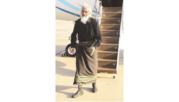 A handout picture released by the Oman News Agency yesterday shows Thomas Uzhunnalil disembarking from a Royal Air Force of Oman plane in Muscat following his release.