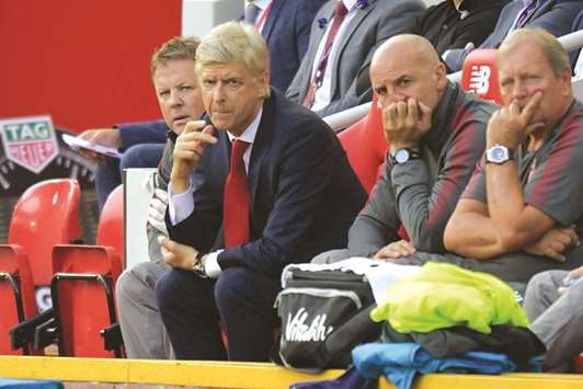 Arsenal manager Arsene Wenger (second from left) looks on during the EPL match against Liverpool on Sunday. (AFP)