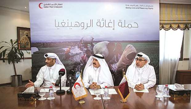 QRCS officials al-Khulaifi, al-Hammadi and al-Ishaq speak at the press briefing yesterday.