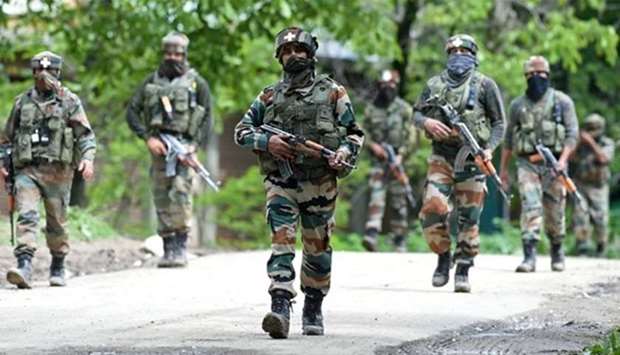 Soldiers conduct a patrol in Kashmir. File picture