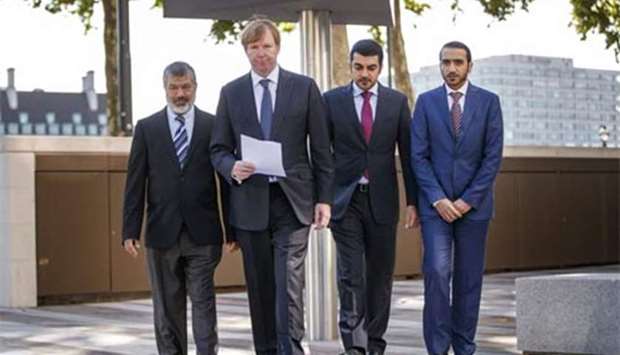 Barrister Rodney Dixon (second left) poses with Hamad Ali al-Hammadi (second right), Mahmoud Abdul Rahman al-Jaidah (left), and Yousef Abdul Samad al-Mullah, as they address the media outside New Scotland Yard in London on Wednesday. Picture: AFP