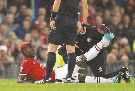 Manchester Unitedu2019s Paul Pogba receives medical attention on Tuesday. (Reuters)