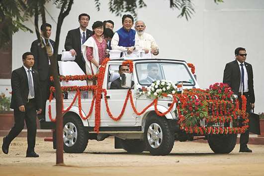 Prime Minister Narendra Modi, his Japanese counterpart Shinzo Abe and his wife Akie Abe arrive at Gandhi Ashram in Ahmedabad yesterday.