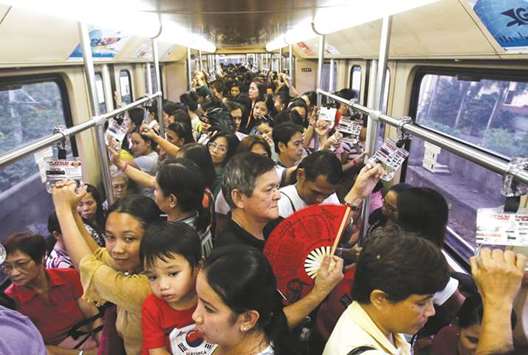 File photo shows commuters on a train during rush hour on Southeast Asiau2019s first light rail transit (LRT) network, which is 29 years old, in Manila.