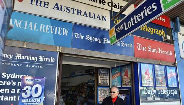 A man leaves a newsagency shop in Sydney