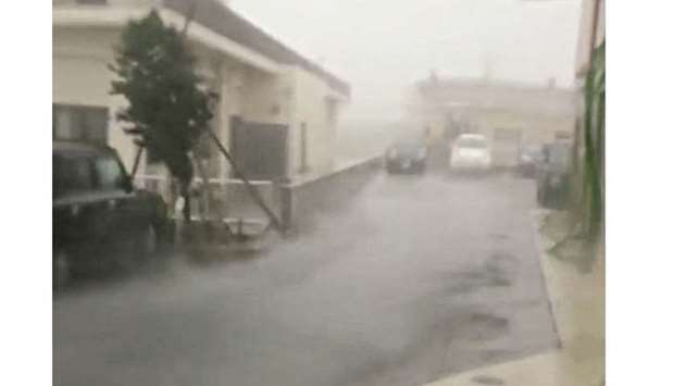 Strong wind and rain are brought by Typhoon Talim in Miyakojima, Japan, yesterday, in this still grab taken from a social media video footage from outside Hotel Rising Sun.