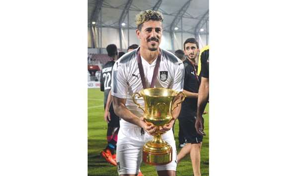 Al Sadd star Baghdad Bounedjah with the Sheikh Jassim Cup which they won last week beating Al Duhail 4-1. Bouedjah scored a hat-trick in the match.