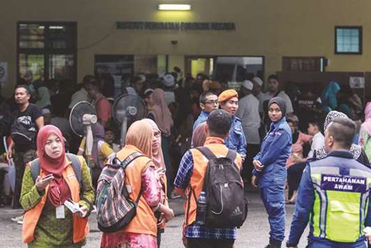 Relatives gather inside the the hospital where fire victims are treated.