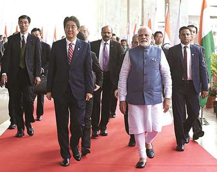 Prime Ministers Narendra Modi and Shinzo Abe arriving at the India-Japan Business Summit at the Mahatma Mandir convention centre in Gandhinagar.