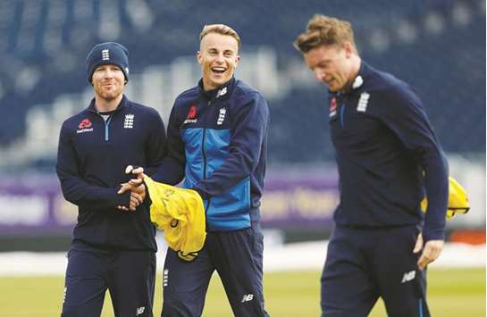 Englandu2019s Eoin Morgan (left), Tom Curran (centre) and Jos Buttler during the nets session in Durham, Britain, yesterday. (Reuters)