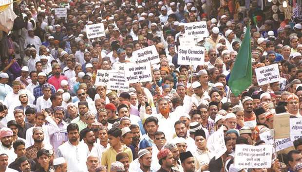 Demonstrators hold placards during a protest rally in Ajmer yesterday against genocide of Rohingya Muslims in Myanmar.