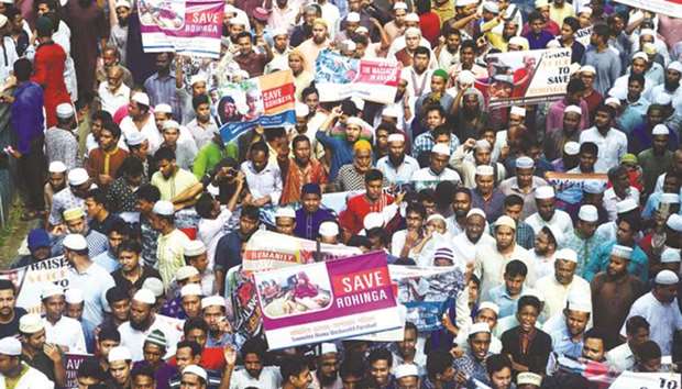 Members of Islamist groups shout slogans during a protest after Friday prayers for the recent violence against Rohingya Muslim in Myanmar, in Dhaka yesterday.