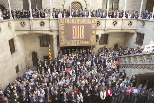 Catalan pro-referendum mayors gather yesterday at the Catalania regional government headquarters in Barcelona. More than 700 of the 948 mayors of Catalonia, threatened with judicial inquiries for supporting a referendum on self-determination banned by Spanish justice, shouted u2018we will voteu2019 and u2018independenceu2019 during the demonstration gathering.