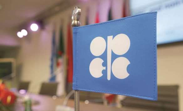 A flag with Opec logo is seen before a news conference at its headquarters in Vienna (file). Opec and its allies are now said to be discussing a further rollover of output cuts ahead of a ministerial meeting scheduled for late November in Vienna.
