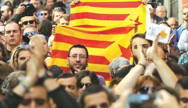 Protesters hold Esteladas, the Catalan separatist flags, during a rally in Madrid yesterday in favour of a planned referendum on the independence of Catalonia.