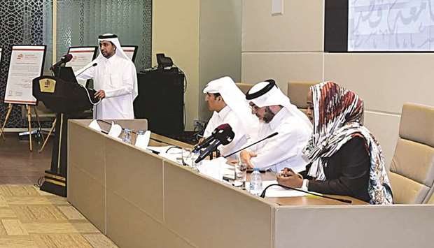 QU president al-Derham addressing a press conference yesterday to announce the latest academic accreditations as senior officials look on.