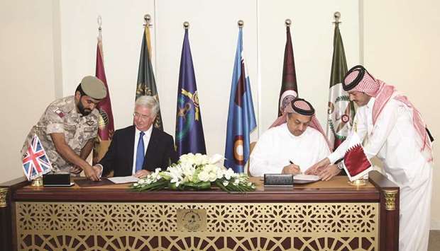 HE the Minister of State of Defence Affairs Dr Khalid bin Mohamed al-Attiyah and Britainu2019s Defence Secretary Michael Fallon sign a Letter of Intent to purchase 24 modern Typhoon aircraft with all their equipment, in Doha yesterday.