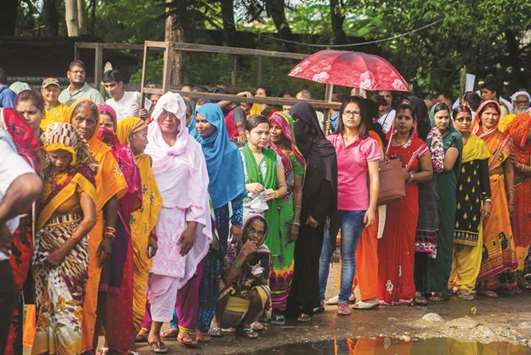 Voters queue before casting their ballots during the third phase of the Nepalese local elections at a polling station at Birgunj Parsa district, some 150km south of Kathmandu, yesterday.