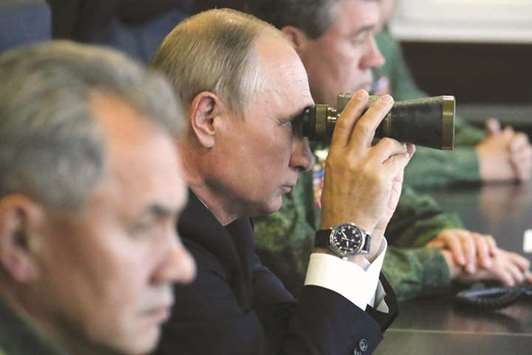 Putin, seen with Defence Minister Sergei Shoigu (left), observes the joint u2018Zapad-2017u2019 (u2018West-2017u2019) military exercises at the Luzhsky training ground, in the Leningrad region, yesterday.