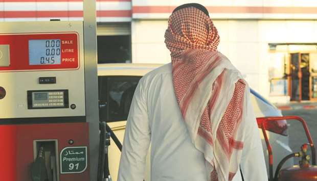 A Saudi man walks past a pump at a petrol station in Jeddah (file). Energy-subsidy reform is a key part of Saudi Arabiau2019s plan to overhaul its struggling economy.