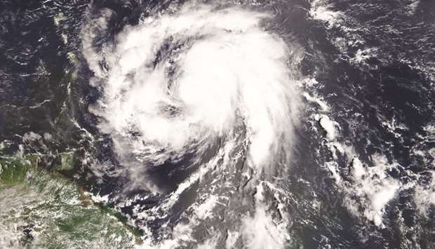 A Nasa satellite photo of Hurricane Maria over the Atlantic Ocean about 145km east of Martinique.