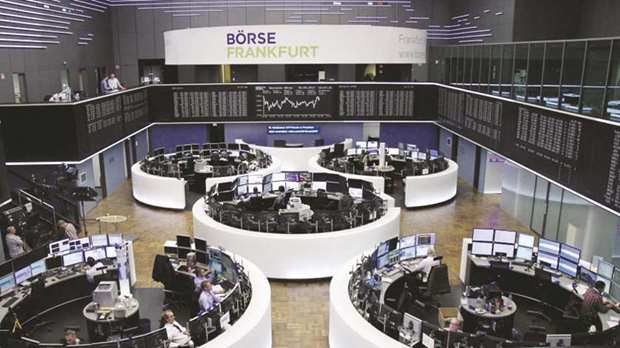 Traders work at the Frankfurt Stock Exchange yesterday. The DAX 30 was 0.02% up at 12,567.79 points at close.