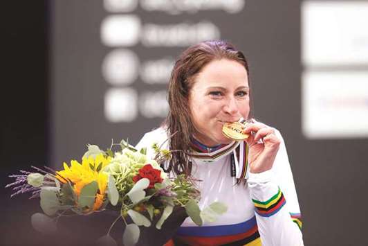 Netherlandu2019s Annemiek Van Vleuten celebrates after winning the womenu2019s individual time trial at the UCI Cycling Road World Championships in Bergen, Norway. (AFP)