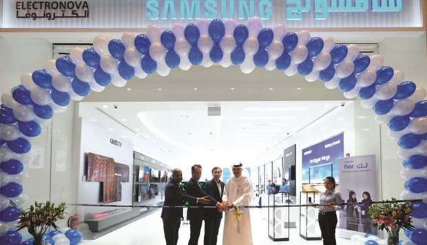 Samsung Gulf Electronics president Chung Lyong Lee, Techno Blue chairman Nabil A R Abu Issa and other officials at the grand opening of the new brand shop at Doha Festival City.