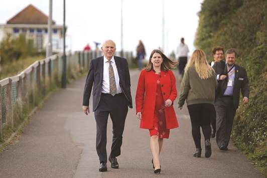 Liberal Democrats leaders Vince Cable and deputy leader, Jo Swinson, arrive to attend the partyu2019s annual conference in Bournemouth, southern England, yesterday.