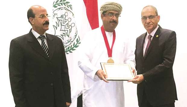 An Oman Air official receiving the award.