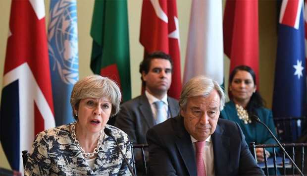 British Prime Minister Theresa May (L)and United Nations Secretary General Antonio Guterres attend the event ,A Call to Action to End Forced Labour, Modern Slavery and Human Trafficking,