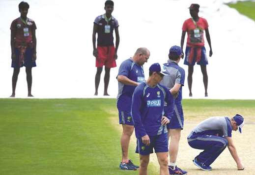 Australiau2019s captain Steve Smith (right) checks the pitch at the Eden Gardens in Kolkata yesterday. (AFP)