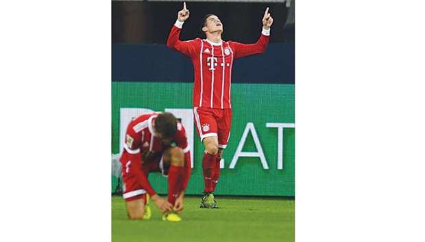 Bayern Munichu2019s Colombian midfielder James Rodriguez celebrates after scoring against Schalke during a Bundesliga match. (AFP)