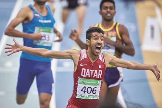 Qataru2019s Jamal Hairane celebrates his win in the menu2019s 800m event at the Asian Indoor & Martial Arts Games in Ashgabat, Turkmenistan, yesterday. (Laurel Photo Services)