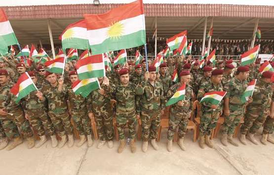 Iraqi Kurdish peshmergas take part in a gathering to urge people to vote in the upcoming independence referendum in Arbil, yesterday.