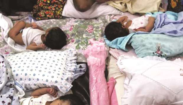 Newborn babies share a bed at a crowded central hospital in Galle, south of Colombo. A TV documentary claims Sri Lankan babies were sold abroad for adoption in the 1980s.