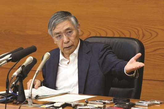 BoJ governor Haruhiko Kuroda gestures during a news conference in Tokyo yesterday. Kuroda and his board left BoJu2019s target interest rates and asset purchase programme unchanged, a decision expected by all 45 economists surveyed by Bloomberg.