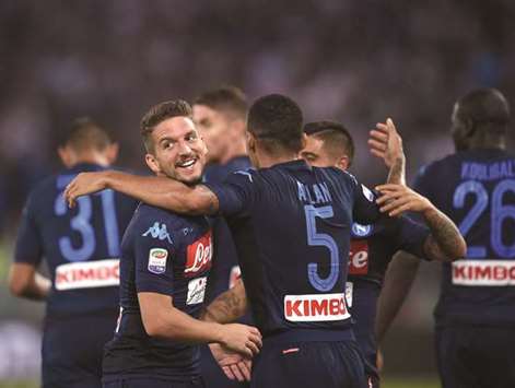 Napoliu2019s Belgian forward Dries Mertens (left) celebrates with teammates after scoring during the Italian Serie A match against at the Olympic Stadium in Rome. (AFP)
