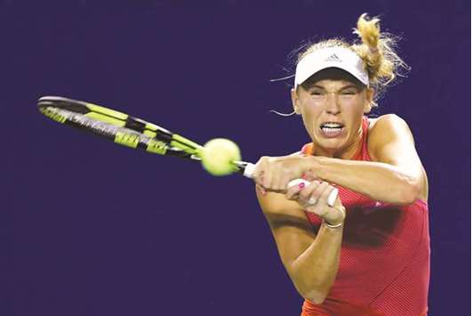 Caroline Wozniacki hits a return during her win over Shelby Rogers at the Pan Pacific Open in Tokyo yesterday. (AFP)